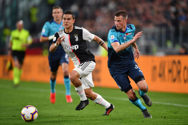 TURIN, ITALY - MAY 19: Paulo Dybala of Juventus competes for the ball with Hans Hateboer of Atalanta BC during the Serie A match between Juventus and Atalanta BC on May 19, 2019 in Turin, Italy. (Photo by Valerio Pennicino - Juventus FC/Juventus FC via Getty Images)